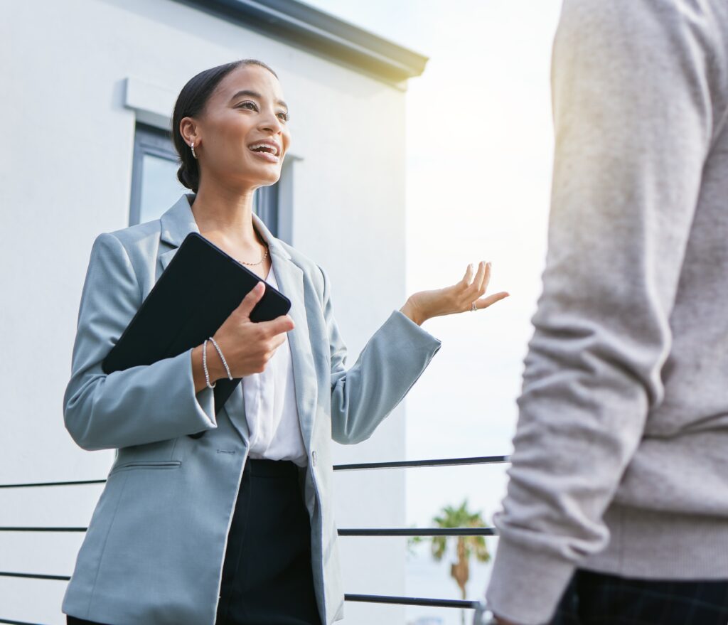 A face-to-face marketing rep talking to a customer.